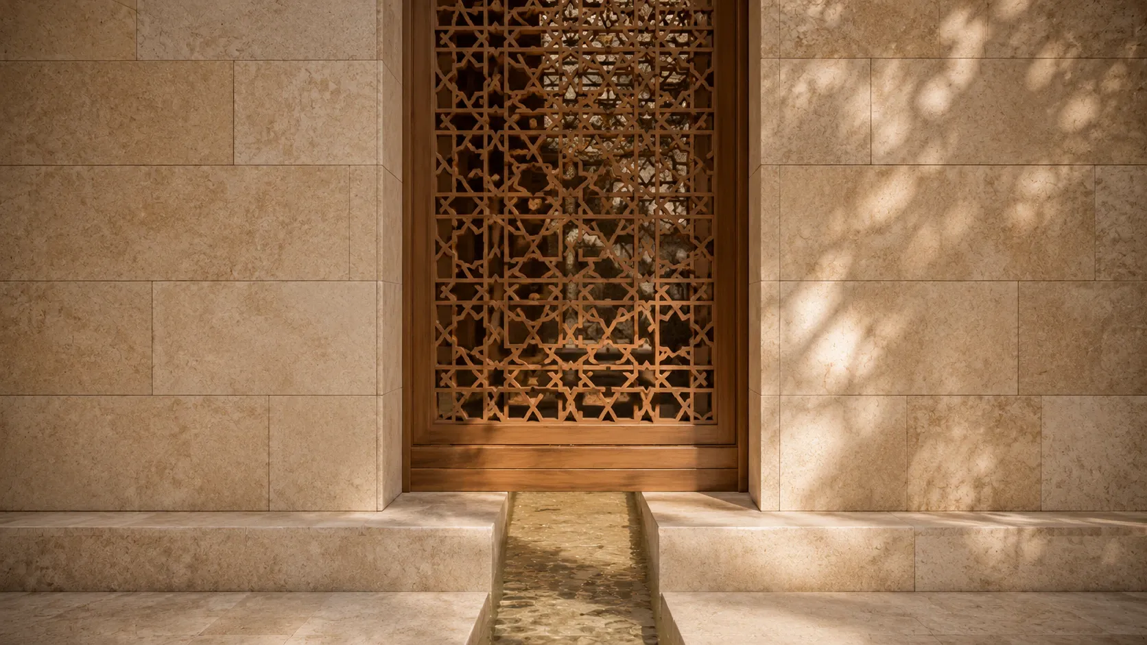 Precisely fitted Palestinian limestone, an Islamic geometric wooden screen, and a narrow water channel shaped by warm natural light.